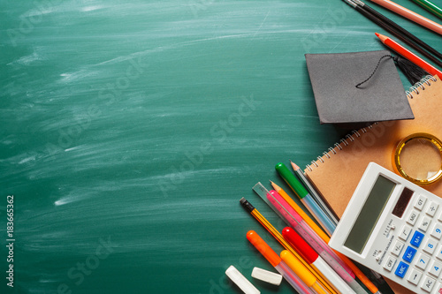 Fotografie, Obraz School supplies on chalkboard background