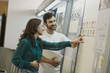 © FotoAndalucia - Couple choosing tiles in ceramic and furniture shop for new home