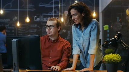 Poster - Male Office Employee Sits at His Desk and Talks with Female Colleague. RED EPIC-W 8K Camera.