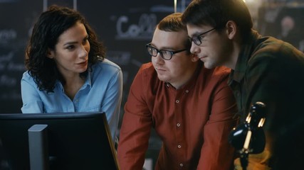 Poster - Three Office Employees Have Discussion about Ongoing Project, They Point at Personal Computer Screen. They Work in the Creative Office. RED EPIC-W 8K Camera.