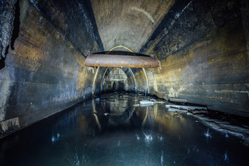 Sticker - Flooded by dirty industrial wastewater sewage collector. Sewer tunnel under city