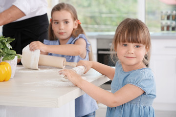 Wall Mural - Cute children in kitchen during cooking classes