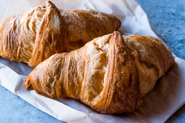 Freshly Baked Croissants on Blue Surface.