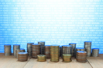 Wall Mural - coin chart pile and blue binary coding computer screen selective focus