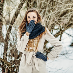 Wall Mural - Happy girl having fun in winter park