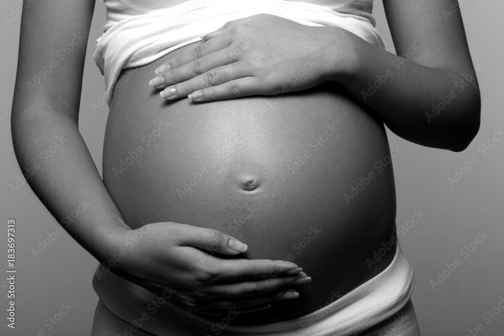 Closeup of a Pregnant Belly - obrazy, fototapety, plakaty 