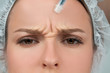 Woman is getting botox injection. Anti-aging treatment and face lift. Cosmetic Treatment and Plastic Surgery