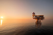Sunset time,Offshore construction platform for production oil and gas, Oil and gas industry and hard work, Production platform and operation process by manual and auto function