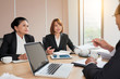 © DragonImages - Discussing business strategy