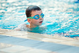 Fototapeta Przestrzenne - Close up of child boy swimming in pool.
