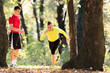 Handsome young men wearing sportswear and exercising in forest at mountain during autumn