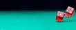 © Sergey - Image of two dice falling on green table
