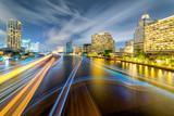 Fototapeta  - Light trails of traffic on the Chao Phraya river, Bangkok. Thailand. view from Taksin bridge Bangkok