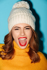 Sticker - Close up portrait of happy cheerful girl in winter hat