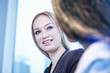 © Connect Images - Woman looking at colleague smiling