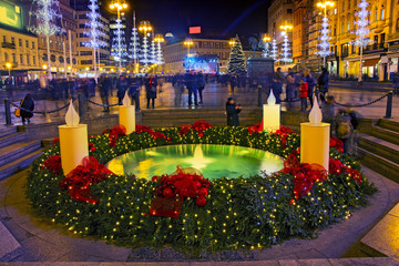 Mandusevac fountain on Ban Jelacic square  decorated with advent wreath as part of  Advent in Zagreb