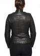 © bjphotographs - Young woman wearing leather motorcycle jacket isolated on white background