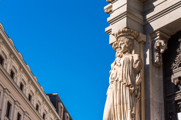 View of the statues on the facade of the building in Madrid, Spain. Copy space for text.