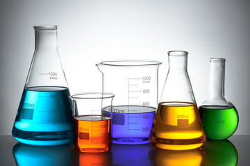 Wall Mural - laboratory glassware set with color liquid and reflection