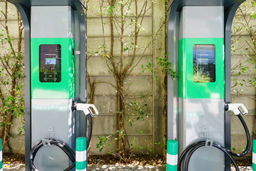 Electric vehicle car charging station in a public parking lot