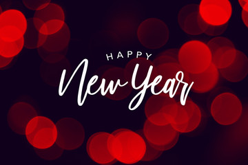 Wall Mural - happy new year celebration text over red duotone bokeh lights background