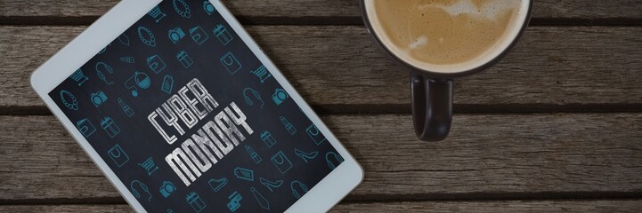 Poster - Composite image of digital tablet and cup of coffee on wooden