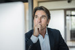 © Westend61 - Portrait of businessman in office thinking
