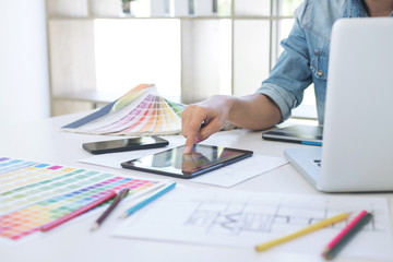 Poster - Color samples, colour chart, swatch sample, Graphic designer being selecting Color table and graphics tablet, pen at workplace with work example on wooden desk