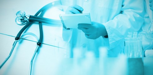 Poster - composite image of stethoscope on desk