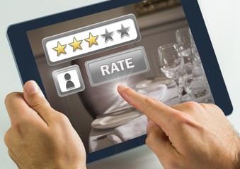 Poster - Hand touching tablet with Rate button and review stars in  in