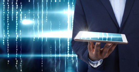 Poster - Hand holding tablet with technology illuminated background