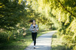 © NDABCREATIVITY - Beautiful woman jogging in nature