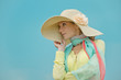 beautiful woman d wide-brimmed hat lived blue background