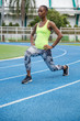 © Jovo Jovanovic/Stocksy - Fit woman stretching before a run