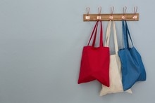 Various Handbags Hanging On Hook