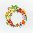 © VICUSCHKA - Healthy clean eating layout, vegetarian food and diet nutrition concept. Various fresh vegetables ingredients for salad on white table background, top view, round frame