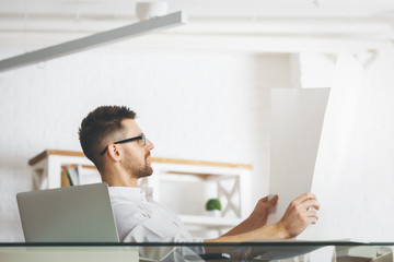 Canvas Print - Handsome guy working on project