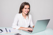 © F8  \ Suport Ukraine - Elegant and cheerful businesswoman. Cheerful young beautiful woman looking at camera with smile while sitting at her working place