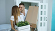 © silverkblack - Young happy couple walking into new house after moving day and kiss each other