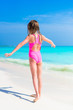 © travnikovstudio - Adorable little girl in swimsuit on beach vacation
