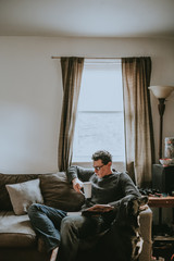 man reading on the sofa 