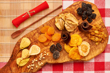 Wall Mural - Dried fruits on tablecloth