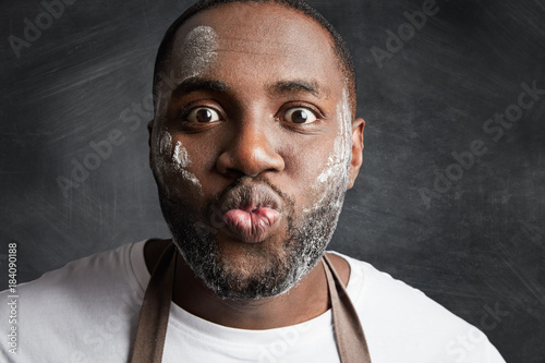 Close Up Portrait Of Funny Male With Dark Skin And Dirty