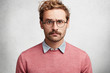 © wayhome.studio - Portrait of attractive bearded young male model looks in stupor and dissatisfaction directly into camera, shocked to read news or have conversation with interlocutor, poses against white background