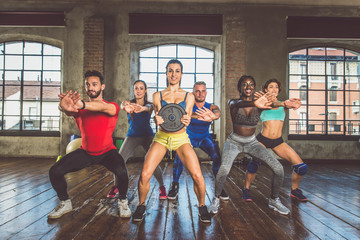 Wall Mural - Athletes training in a gym