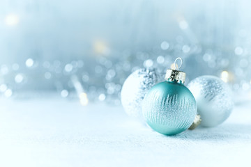 Wall Mural - Silver and Blue Christmas Balls on white wooden background