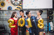 © smilepoker - Happy friends greeting in New year party and celebrating birthday gift concept