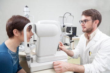 Young woman during an eye exam with the ophthalmologist