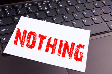 Poster - Writing Nothing text made in the office close-up on laptop computer keyboard. Business concept for Contradiction Nothing Rejection Workshop on the black background with copy space