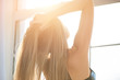 © DenisProduction.com - Young woman touching her hair. Girl, morning light.